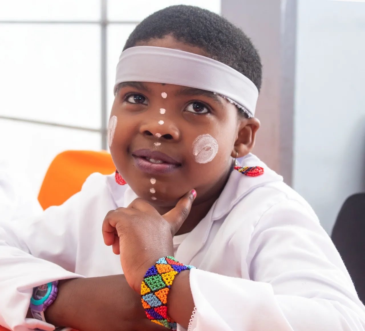 Cornelius Schools learner in traditional attire with beaded accessories